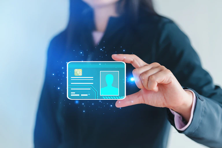 A woman holding a holographic card.