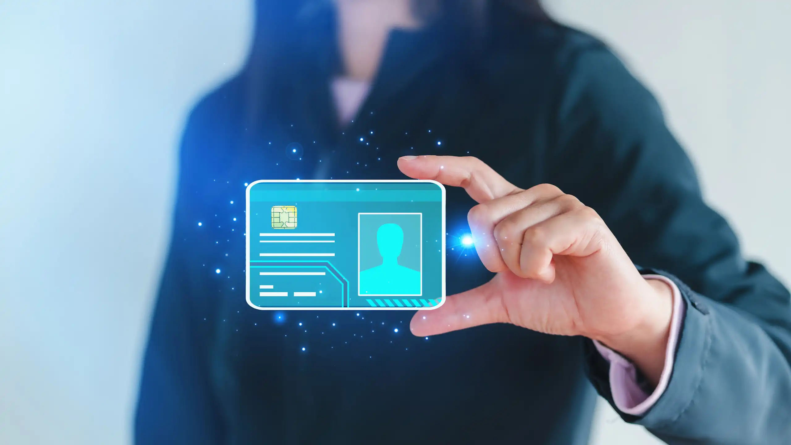 A woman holding a holographic card.
