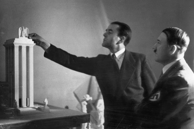Albert Speer and Adolf Hitler in 1937 looking at an architectural model