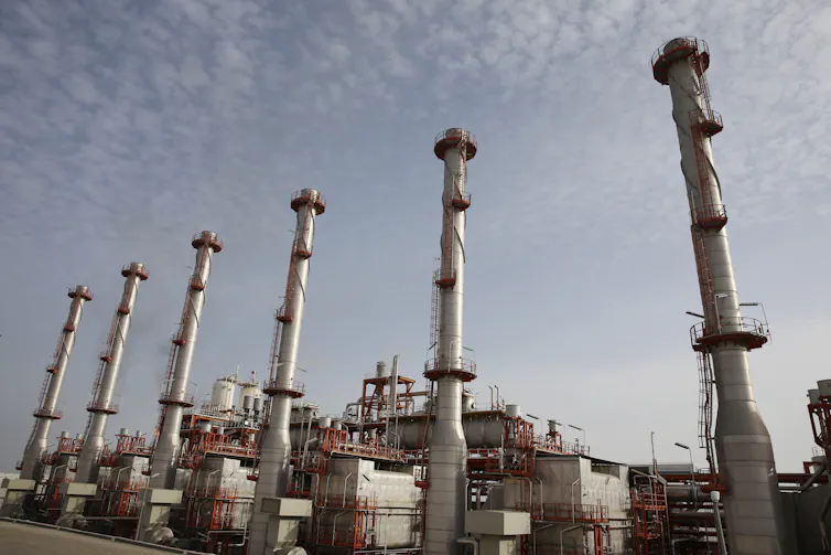 Large industrial towers stand side by side.