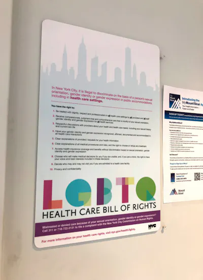 Sign on wall listing New York's 'LGBTQ HEALTH CARE BILL OF RIGHTS'