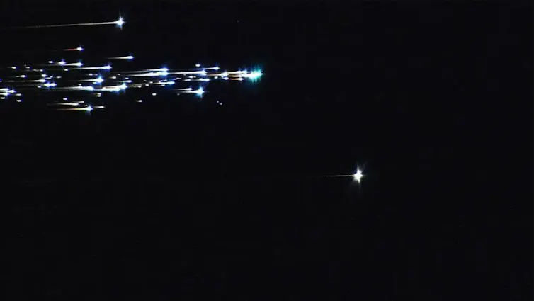 A streak of bright lights against a black background.
