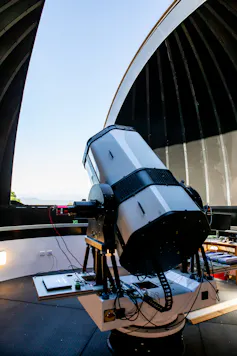 A telescope-like device pointing at the sky.
