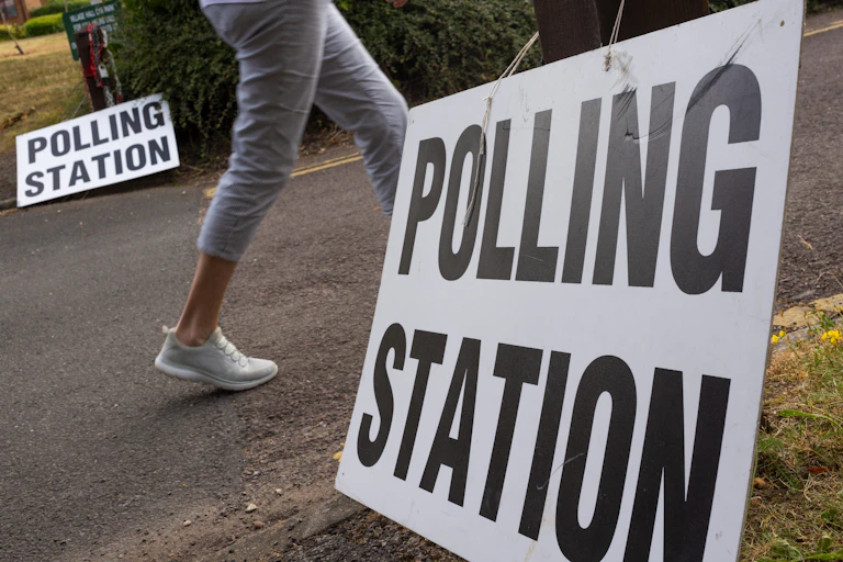 Woman walking towards polling station