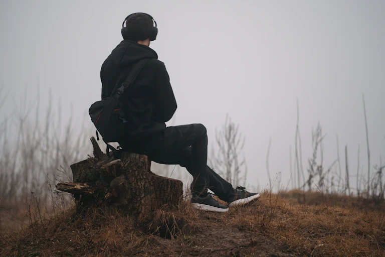 Man sat alone wearing headphones
