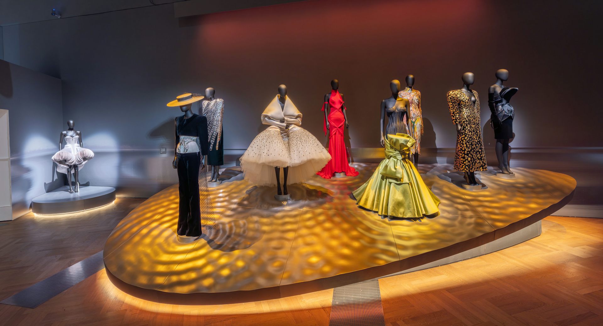 An exhibition of mannequins wearing high fashion.