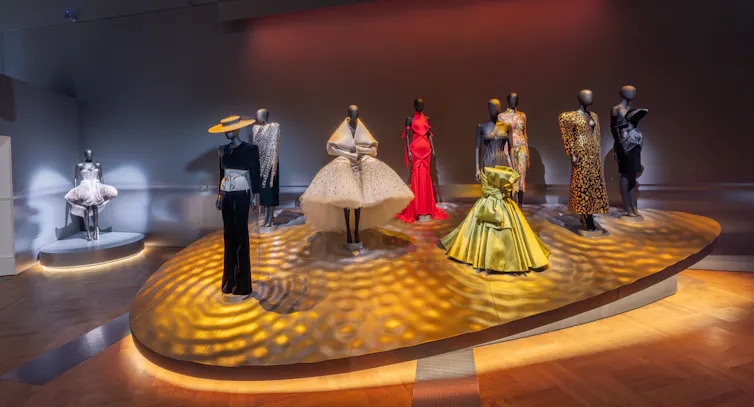 An exhibition of mannequins wearing high fashion.