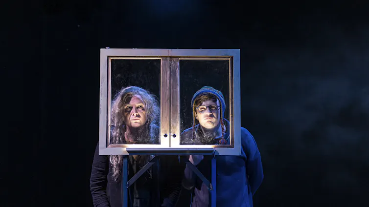 Production photo: Pamela Rabe and Daniel R Nixon look through window panes.