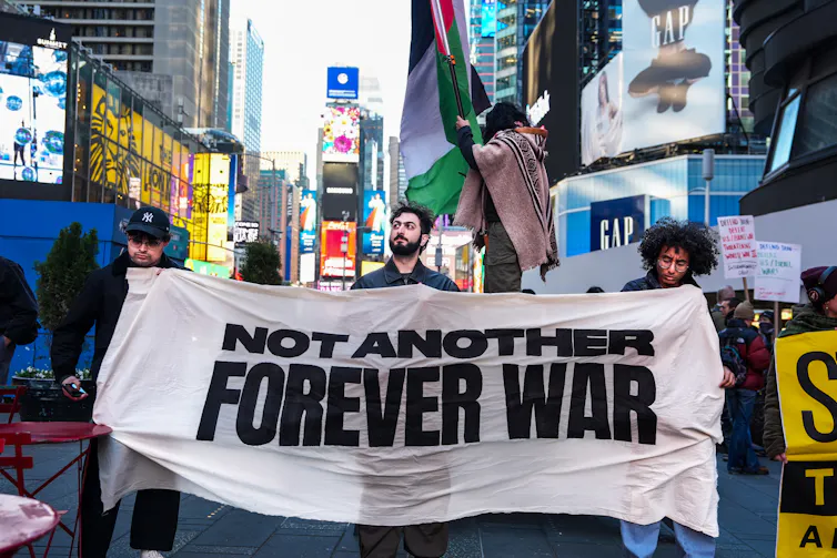 A protest banner saying not another forever war