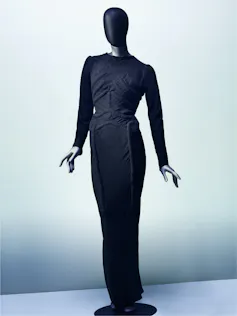 Style Turns into Artwork: a deliciously decadent adventure in the course of the surrealist international of Elsa Schiaparelli 3 A black close fitting dress with the outline of a ribcage on it.
