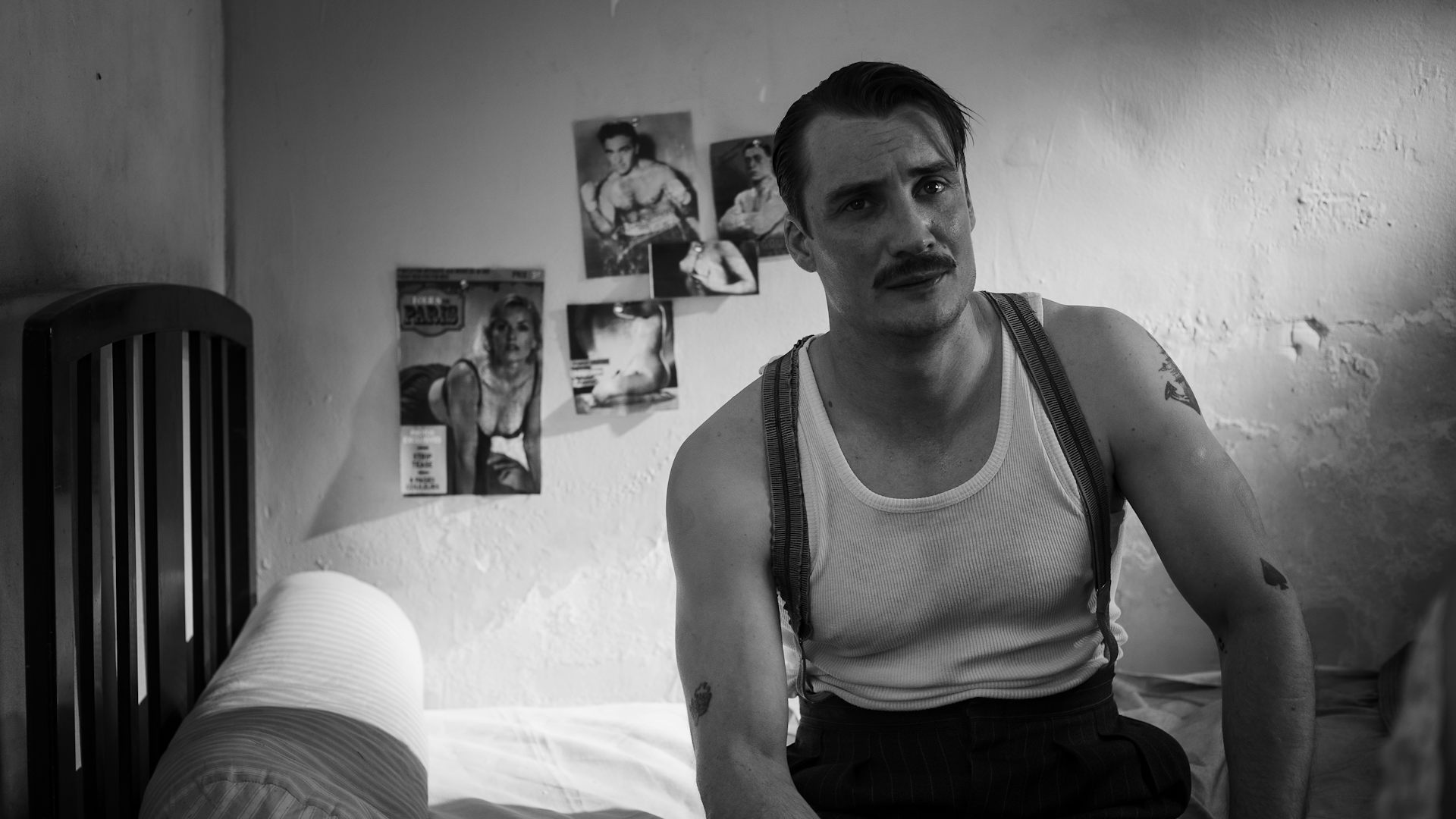 A man sat on his bed