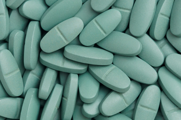 A pile of big green pills.