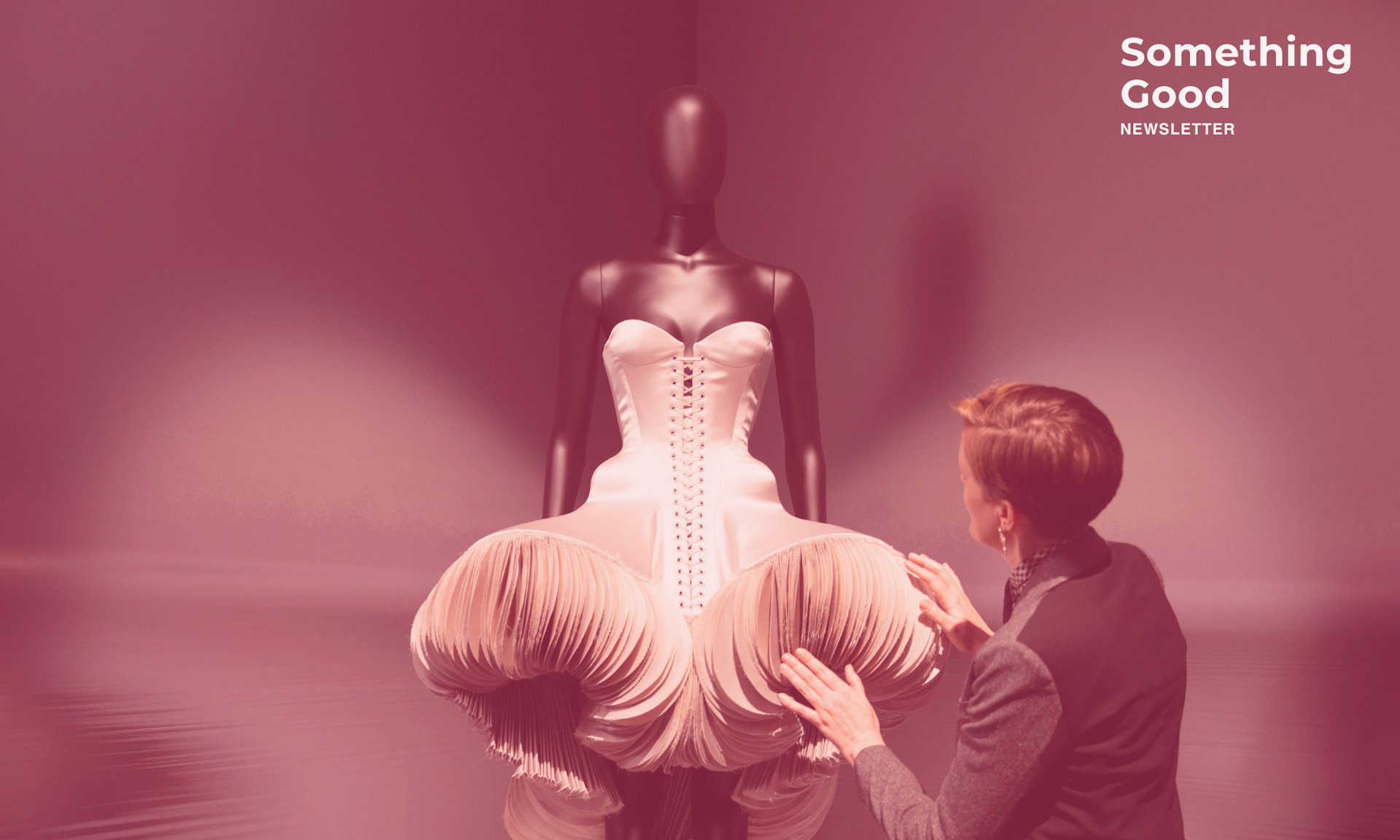 A mannequin in a sculptured dress.