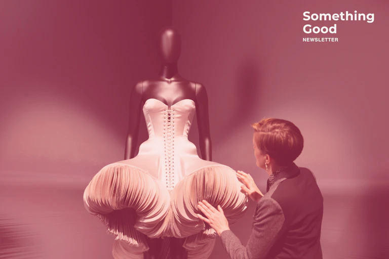 A mannequin in a sculptured dress.