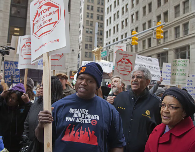 Man holds sign