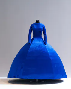 A voluminous blue dress on a mannequin.