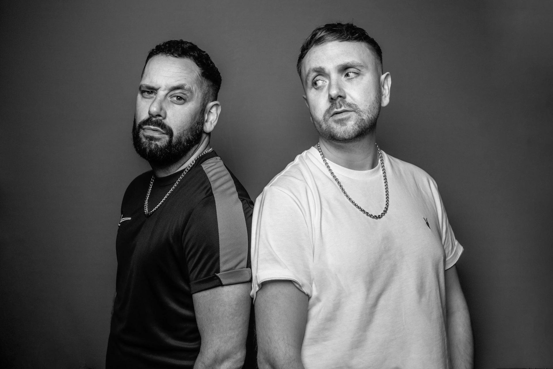 Black and white photo of directors Neil Ely and Lloyd Eyre Morgan.