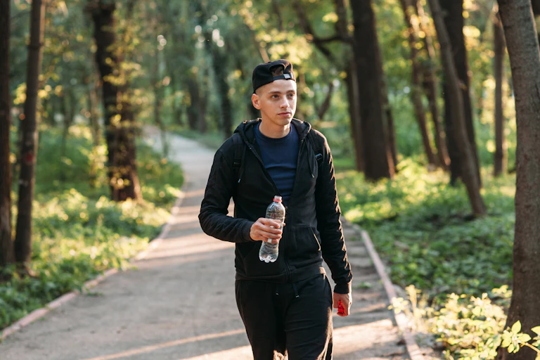 Young man walking outside