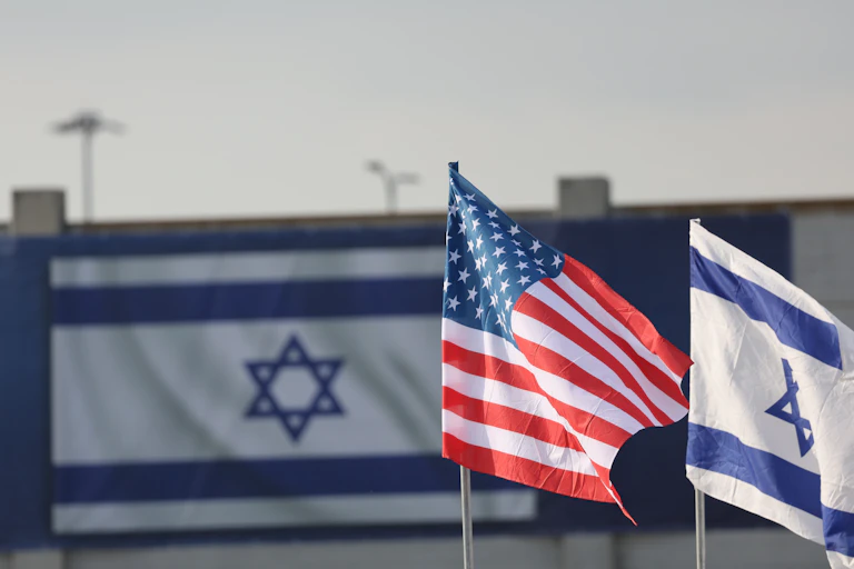 Israeli and US flags hang at Ben Gurion Airport near Tel Aviv