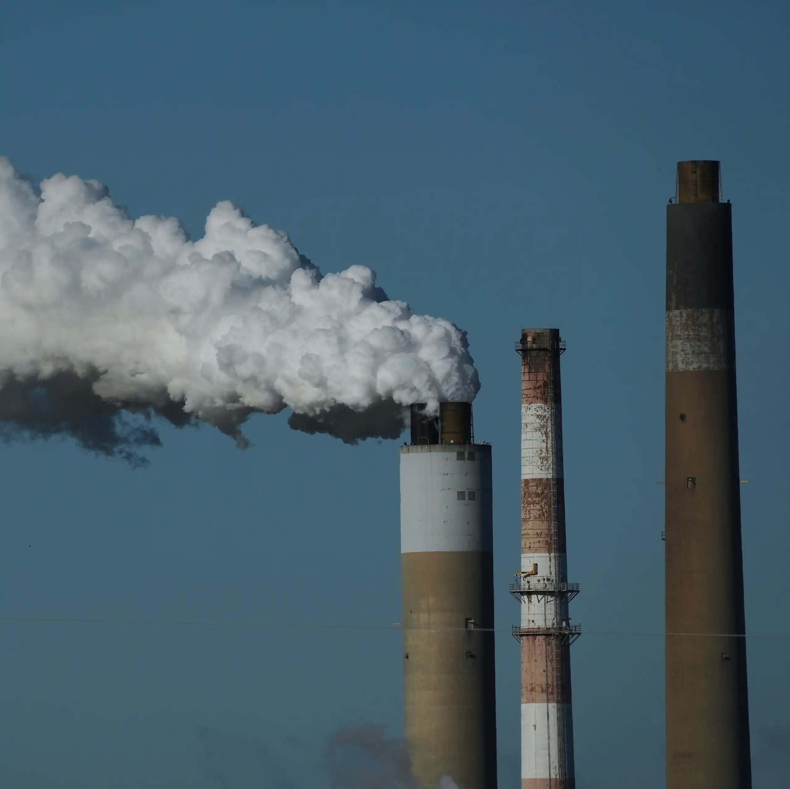 Factory chimneys sending up smoke