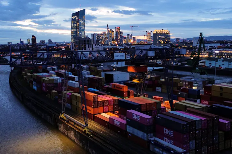 Shipping containers stacked at a cargo terminal