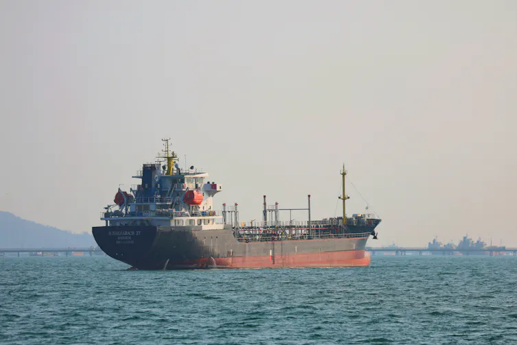 A ship sits in the waters off the Strait of Hormuz.