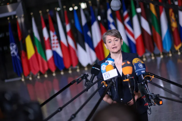 uk foreign secretary yvette cooper addresses journalists at a nato conference in brussels in december 2025.