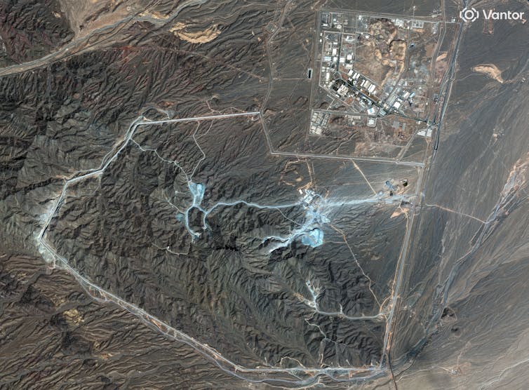 A complex of roads and buildings seen from a satellite image.
