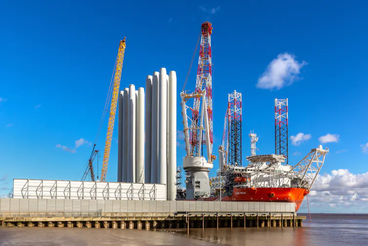 large wind turbines on a dock
