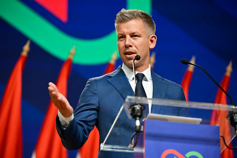 A politician speaks to the media