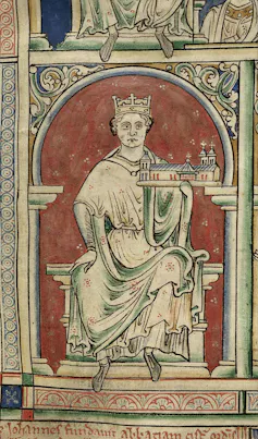 A faded illustration of a man in robes, seated on a throne, with a crown on his head and a model building held up in his palm.