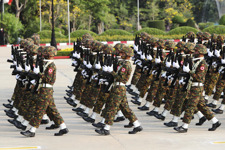 Members of the Myanmar military march during a parade.
