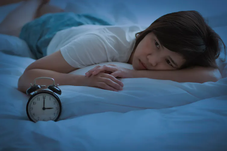 Woman lies awake with stress at 3am