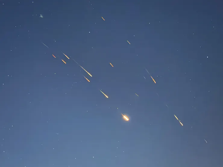Missile traces are seen in the sky.