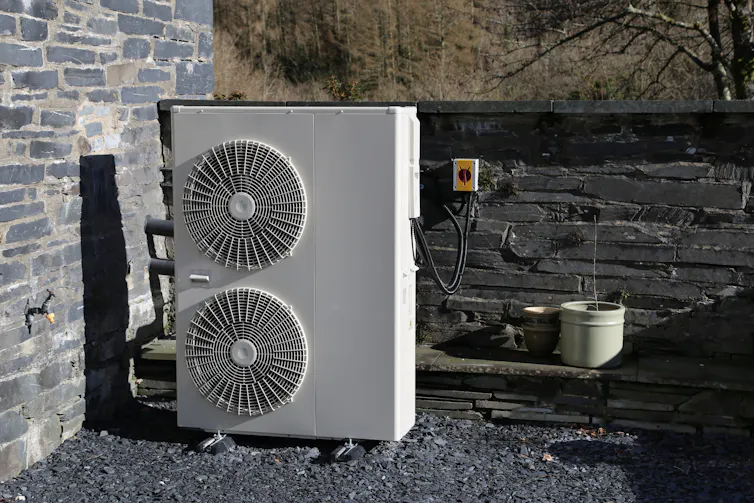 air source heat pump outside a home