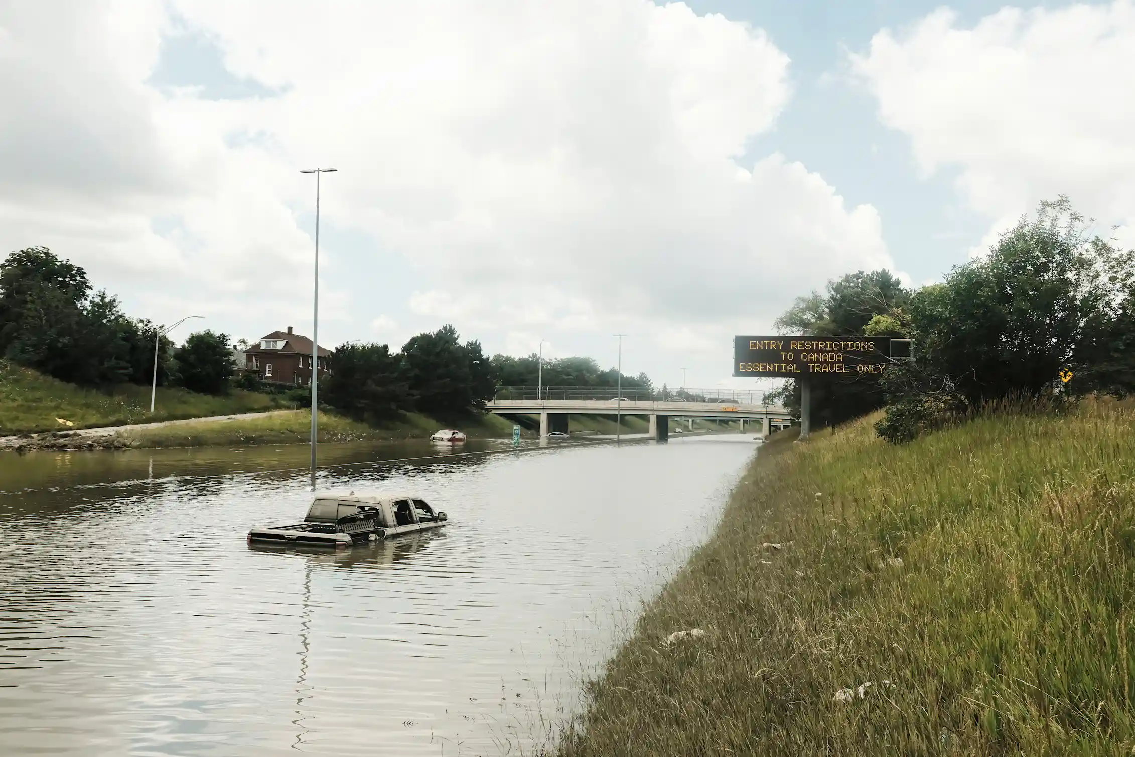 Truck stuck in flooded highway