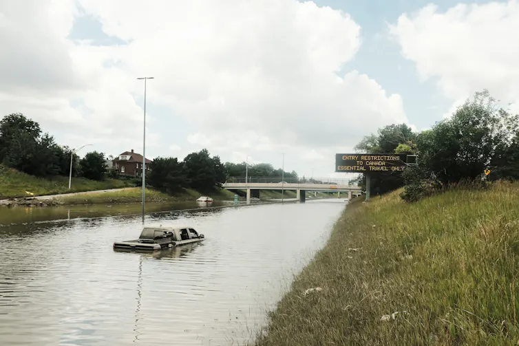 Truck stuck in flooded highway