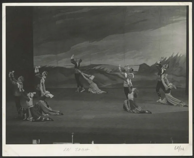 Black and white photo: pairs of dancers on stage.