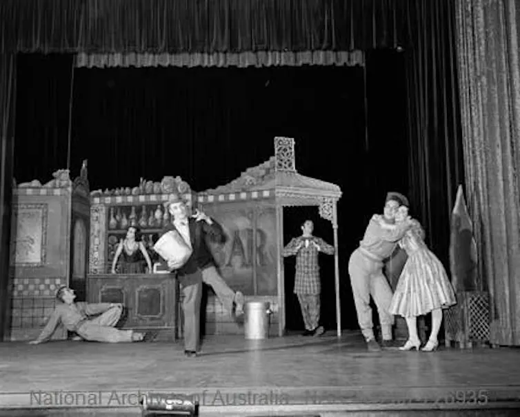 Black and white photo: a scene at a bar.