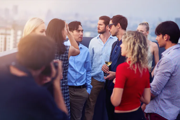 Group of people chatting.