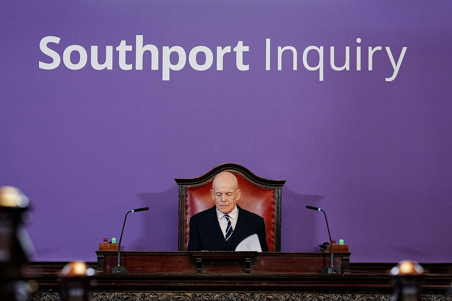 Sir Adrian Fulford in front of a sign reading Southport Inquiry