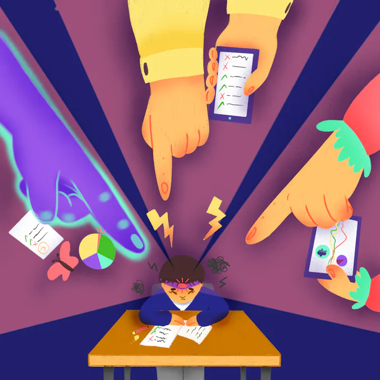 A child sits at a desk and has many large fingers pointing at him, as fumes seem to come out of his head in a cartoon image.