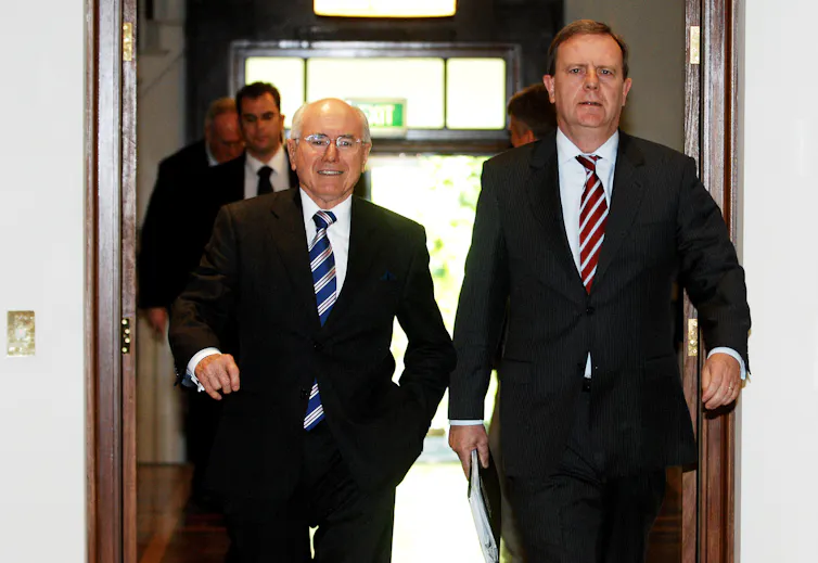 photo of then Prime Minister John Howard (left) and Federal Treasurer Peter Costello