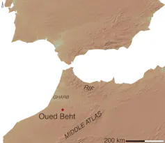 A map in brown and white showing two land masses almost joining, but separated by a stretch of water.