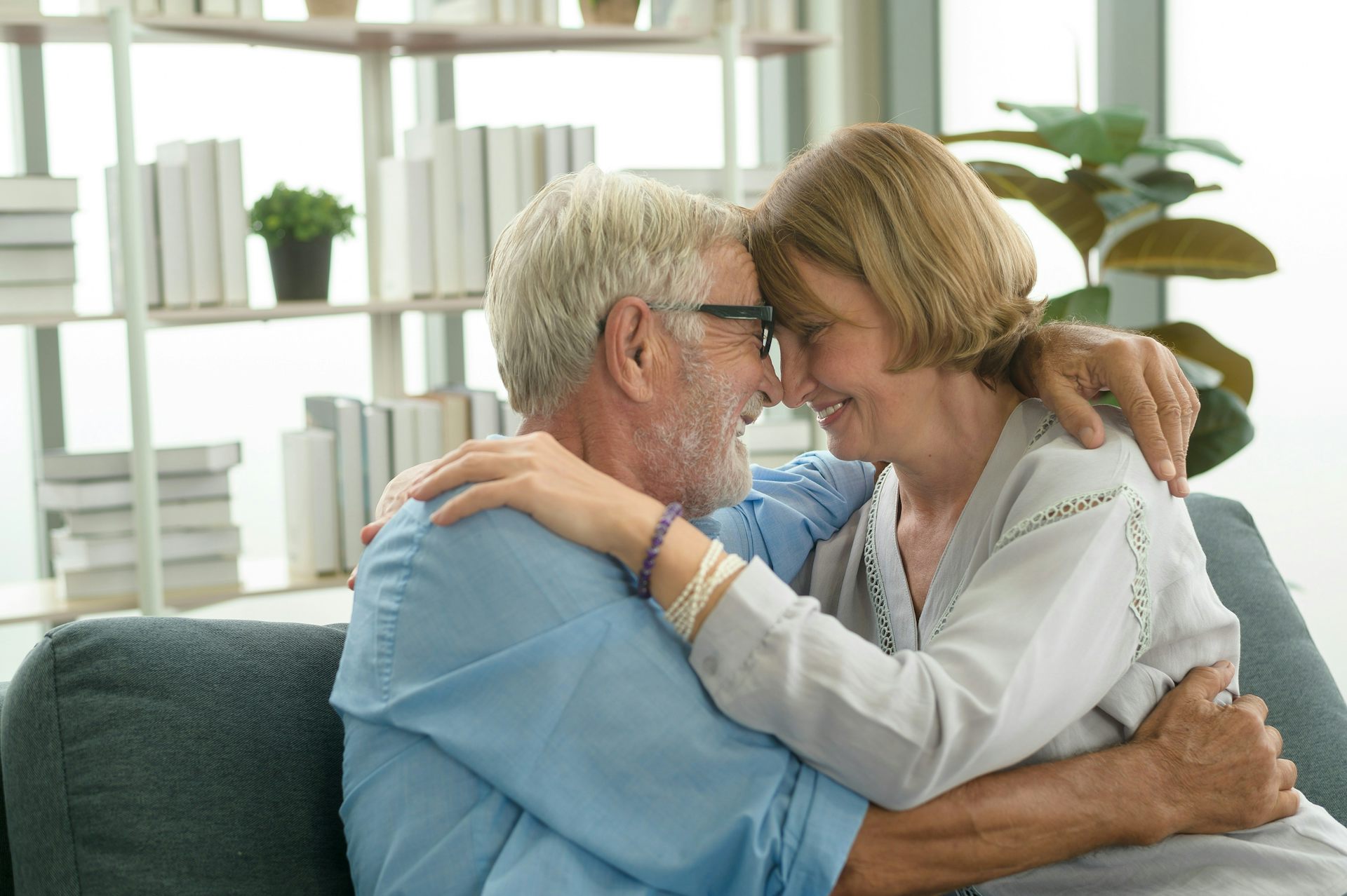 an older white couple embraces