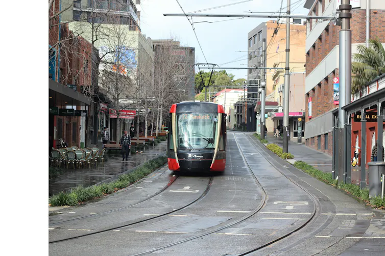 tram passing through city street.
