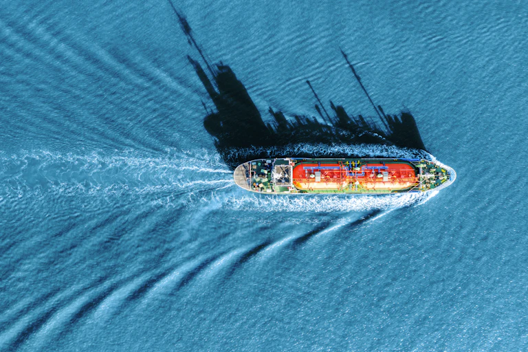 Birds-eye view of a ship on the sea.