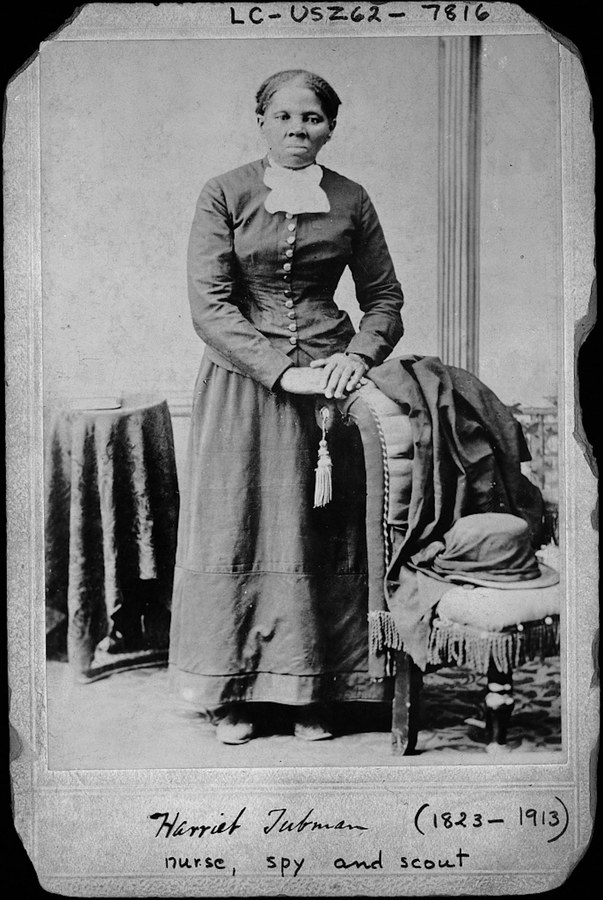 Black and white portrait of Black woman in 19th-century dress