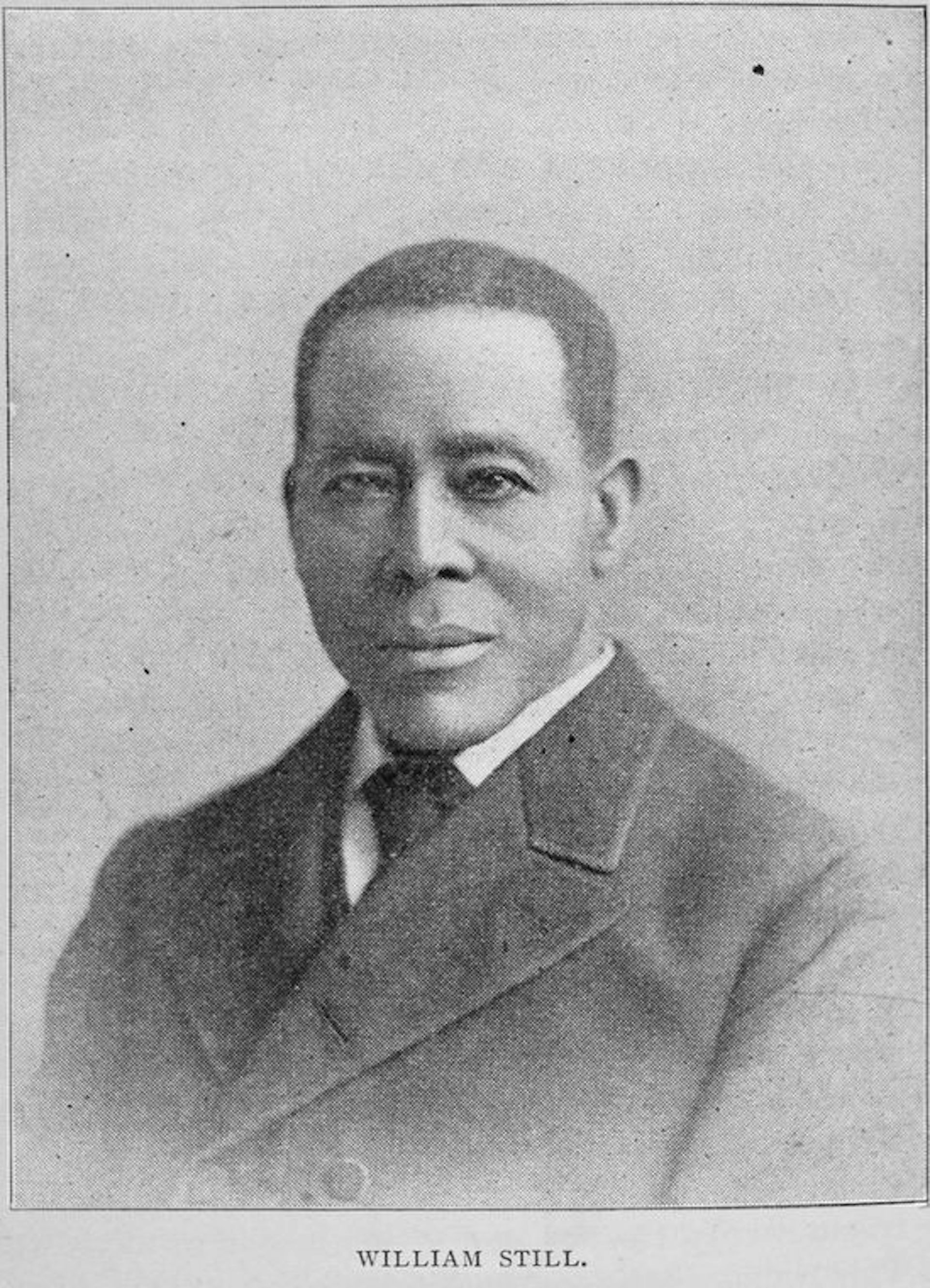 Black and white portrait of man in suit