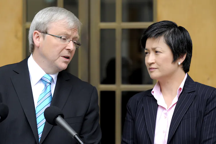 Kevin Rudd speaks to Penny Wong at a press conference